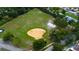 Aerial view of community park with baseball diamond and wooded area at 11426 Glenmont Dr, Tampa, FL 33635