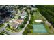 Aerial view shows the neighborhood's proximity to a community basketball court and grassy field, close to attractive homes at 11426 Glenmont Dr, Tampa, FL 33635