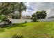 Spacious backyard enclosed by a privacy fence and mature trees for added seclusion at 11426 Glenmont Dr, Tampa, FL 33635