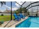 Relaxing pool area with comfortable chairs, ideal for enjoying sunny days and the refreshing water of the pool at 11426 Glenmont Dr, Tampa, FL 33635