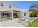 Backyard with a pool, spa, and covered patio offering a serene and luxurious outdoor experience at 4536 W Swann Ave, Tampa, FL 33629