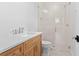 Modern bathroom with a glass enclosed shower, wood vanity, and contemporary fixtures at 4536 W Swann Ave, Tampa, FL 33629