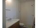 Bathroom showcasing a modern vanity with stone countertop and tiled walk-in shower at 4536 W Swann Ave, Tampa, FL 33629