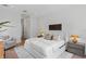 Inviting bedroom featuring a plush bed, neutral color palette, and ample natural light for a serene ambiance at 4536 W Swann Ave, Tampa, FL 33629