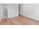 Bedroom with hardwood floors, an adjacent bathroom, and neutral paint at 4536 W Swann Ave, Tampa, FL 33629
