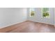 Bright bedroom with hardwood floors, large windows, and a minimalist design at 4536 W Swann Ave, Tampa, FL 33629