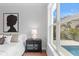 Bedroom with a stylish dresser, large window overlooking the pool at 4536 W Swann Ave, Tampa, FL 33629