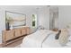 Cozy bedroom featuring warm wood floors, natural light, and stylish furniture creating a restful retreat at 4536 W Swann Ave, Tampa, FL 33629