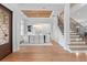 Elegant entryway featuring a staircase, formal dining area with a wooden ceiling, and natural light at 4536 W Swann Ave, Tampa, FL 33629