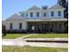 Charming two-story home featuring a brick-accented facade, a well-manicured lawn, and an inviting entrance at 4536 W Swann Ave, Tampa, FL 33629