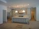 Spacious kitchen with a large island, modern appliances, and bright lighting at 4536 W Swann Ave, Tampa, FL 33629