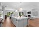 Spacious kitchen with a large island, modern appliances, and an open floor plan to the living area at 4536 W Swann Ave, Tampa, FL 33629