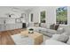 Inviting living room with a cozy sectional sofa, accent chairs, and a stylish coffee table at 4536 W Swann Ave, Tampa, FL 33629