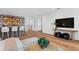 Open-concept living area features a wet bar, stylish furniture, and easy access to other rooms at 4536 W Swann Ave, Tampa, FL 33629