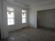 Bright living room with tray ceiling and large windows providing natural light at 4536 W Swann Ave, Tampa, FL 33629