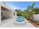 Backyard pool and spa with a covered patio area, creating a private and relaxing outdoor space at 4536 W Swann Ave, Tampa, FL 33629