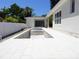 Backyard with a modern pool and a patio area, perfect for outdoor relaxation and entertaining at 4536 W Swann Ave, Tampa, FL 33629
