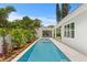 Modern backyard pool and spa with well-kept tropical landscaping providing a private outdoor oasis at 4536 W Swann Ave, Tampa, FL 33629