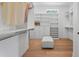 Spacious walk-in closet with custom organizers, shelving, drawers, and a comfortable seating area at 4536 W Swann Ave, Tampa, FL 33629