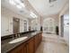 Elegant bathroom with double vanity, soaking tub, and separate shower at 1299 Coverstone Ct, Oldsmar, FL 34677