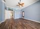 Spacious living room with hardwood floors and lots of natural light at 1299 Coverstone Ct, Oldsmar, FL 34677