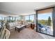 Living room with balcony access and water views at 6218 Palma Del Mar S Blvd # 606, St Petersburg, FL 33715