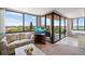 Living room with comfortable seating and lake view at 6218 Palma Del Mar S Blvd # 606, St Petersburg, FL 33715