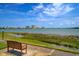 Scenic waterfront view with a peaceful bench at 6218 Palma Del Mar S Blvd # 606, St Petersburg, FL 33715