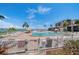 Inviting community pool with lounge chairs and waterfront views at 6218 Palma Del Mar S Blvd # 606, St Petersburg, FL 33715