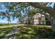 Condo building with lush landscaping and waterfront access at 6218 Palma Del Mar S Blvd # 606, St Petersburg, FL 33715