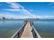 Wooden dock extending into the calm waters at 6218 Palma Del Mar S Blvd # 606, St Petersburg, FL 33715