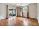 Bright bedroom featuring hardwood floors and access to backyard at 205 Se Monroe N Cir, St Petersburg, FL 33703