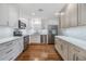 Modern kitchen features stainless steel appliances and white shaker cabinets at 205 Se Monroe N Cir, St Petersburg, FL 33703