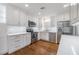 Updated kitchen with stainless steel appliances and white cabinetry at 205 Se Monroe N Cir, St Petersburg, FL 33703