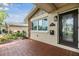 House exterior with tiled entryway and black door at 205 Se Monroe N Cir, St Petersburg, FL 33703