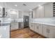 Modern kitchen with stainless steel appliances and white cabinets at 205 Se Monroe N Cir, St Petersburg, FL 33703
