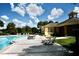 Relaxing pool area with clubhouse view at 36121 Lake Chase Blvd # 204, Zephyrhills, FL 33541