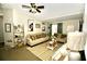 Living room with beige couch, coffee table, and rug at 36121 Lake Chase Blvd # 204, Zephyrhills, FL 33541