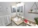 Clean and bright bathroom with updated vanity and stylish decor at 36121 Lake Chase Blvd # 204, Zephyrhills, FL 33541