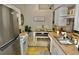 Open concept kitchen with a dining area and plenty of cabinet storage at 36121 Lake Chase Blvd # 204, Zephyrhills, FL 33541