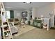Bright and spacious living room with ample natural light and comfortable seating at 36121 Lake Chase Blvd # 204, Zephyrhills, FL 33541