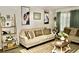 Cozy living room featuring a comfortable sofa, stylish coffee table, and decorative accents at 36121 Lake Chase Blvd # 204, Zephyrhills, FL 33541