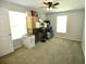 Spacious bedroom with large windows, neutral colored carpet, and ceiling fan at 36121 Lake Chase Blvd # 204, Zephyrhills, FL 33541