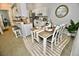 Eat-in kitchen with a breakfast bar, white cabinets, and modern appliances at 36121 Lake Chase Blvd # 204, Zephyrhills, FL 33541