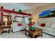 Open living room showcasing neutral-toned furniture and a coffee table at 11426 Glenmont Dr, Tampa, FL 33635