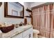 Updated bathroom features granite countertops, a large mirror, and a shower with a curtain at 11426 Glenmont Dr, Tampa, FL 33635