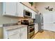 Modern kitchen with stainless steel appliances and granite countertops at 11426 Glenmont Dr, Tampa, FL 33635