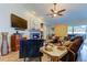 Cozy living room with a fireplace, comfortable seating and hardwood floors at 11426 Glenmont Dr, Tampa, FL 33635