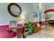 Bright entryway with hardwood floors, decorative bench, and glass-top table at 11426 Glenmont Dr, Tampa, FL 33635