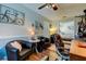 Home office with hardwood floors, comfortable seating, and a view of the bedroom at 11426 Glenmont Dr, Tampa, FL 33635